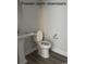 Downstairs powder room with pedestal sink and toilet at 1327 Winding Creek Way, Myrtle Beach, SC 29588