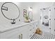 Modern bathroom with white cabinets and hexagon floor tiles at 2192 Eastwoods Dr., Conway, SC 29526