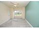 Spacious bedroom with window, carpet, and ceiling fan at 110 South Shore Blvd. # 202, Longs, SC 29568