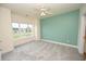 Bright bedroom with large window, carpet, and ceiling fan at 110 South Shore Blvd. # 202, Longs, SC 29568