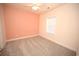 Bedroom with carpet, ceiling fan and peach wall at 110 South Shore Blvd. # 202, Longs, SC 29568