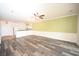 Open living room features wood-look floors and an island kitchen at 110 South Shore Blvd. # 202, Longs, SC 29568