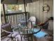 Relaxing outdoor balcony space with comfortable seating, table, and decorative accessories at 118 Salt Marsh Circle # 25B, Pawleys Island, SC 29585