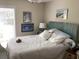 Cozy bedroom with bright natural light, comfortable bed, and stylish décor at 118 Salt Marsh Circle # 25B, Pawleys Island, SC 29585
