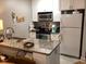 Functional kitchen with granite counters, modern appliances, and white cabinets at 118 Salt Marsh Circle # 25B, Pawleys Island, SC 29585