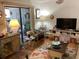 Cozy living room with sliding glass doors leading to an outdoor space and neutral color scheme throughout at 118 Salt Marsh Circle # 25B, Pawleys Island, SC 29585