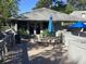 Outdoor seating area on a wooden deck with chairs and a table at 118 Salt Marsh Circle # 25B, Pawleys Island, SC 29585