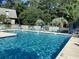 Community pool with clear water and plenty of poolside seating available at 118 Salt Marsh Circle # 25B, Pawleys Island, SC 29585