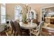 Elegant dining room boasting a chandelier and large windows with natural light at 2000 Kilkee Dr., Myrtle Beach, SC 29579
