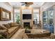 Bright living room featuring a fireplace, and sliding glass doors to the outside at 2000 Kilkee Dr., Myrtle Beach, SC 29579