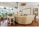 Bright living room featuring hardwood floors, ceiling fans and large windows at 2000 Kilkee Dr., Myrtle Beach, SC 29579