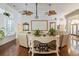 Bright living room featuring hardwood floors, ceiling fans and large windows at 2000 Kilkee Dr., Myrtle Beach, SC 29579