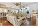 Open-concept living room featuring hardwood floors, large windows, and elegant furnishings at 2000 Kilkee Dr., Myrtle Beach, SC 29579