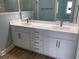 A bathroom with a double sink vanity with a marble countertop at 1738 Cenith Dr., North Myrtle Beach, SC 29582