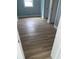 Bright bedroom with wood-look floors, neutral walls, and white trim, creating a clean and modern aesthetic at 1738 Cenith Dr., North Myrtle Beach, SC 29582
