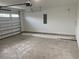 View of an attached garage, ample space for parking and storage with concrete flooring and walls at 1738 Cenith Dr., North Myrtle Beach, SC 29582