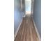 Well-lit hallway featuring wood-look flooring and neutral wall paint creating an inviting and modern atmosphere at 1738 Cenith Dr., North Myrtle Beach, SC 29582
