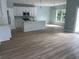 Bright kitchen with a center island, stainless steel appliances, and a sliding glass door to the outdoors at 1738 Cenith Dr., North Myrtle Beach, SC 29582