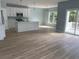 Open-concept living space with a kitchen featuring an island, stainless steel appliances, and ample natural light at 1738 Cenith Dr., North Myrtle Beach, SC 29582