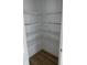 A walk-in pantry featuring multiple white wire shelves to maximize storage space with wood-look flooring at 1738 Cenith Dr., North Myrtle Beach, SC 29582