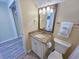 Compact bathroom with a granite vanity and a commode. Includes a mirrored medicine cabinet at 122 Hartland Dr. # 11-D, Myrtle Beach, SC 29572