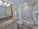 Cozy bathroom featuring a vanity with granite countertop and a shower-tub combo at 122 Hartland Dr. # 11-D, Myrtle Beach, SC 29572