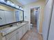 Bathroom featuring double sinks, granite countertops, and a glass-enclosed shower at 122 Hartland Dr. # 11-D, Myrtle Beach, SC 29572