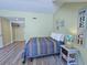 Comfortable bedroom with one bed, and a walk-in closet; decorated with beach-themed artwork at 122 Hartland Dr. # 11-D, Myrtle Beach, SC 29572