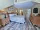 Bedroom with hardwood floors, offering an en suite bathroom and easy access to other rooms at 122 Hartland Dr. # 11-D, Myrtle Beach, SC 29572