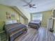 Bright bedroom featuring two beds, ceiling fan, and a window providing natural light at 122 Hartland Dr. # 11-D, Myrtle Beach, SC 29572