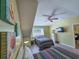 Well-lit bedroom with two beds, beach-themed decor, a ceiling fan and a window at 122 Hartland Dr. # 11-D, Myrtle Beach, SC 29572