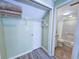 A well-organized closet area adjacent to a bathroom, featuring ample storage space at 122 Hartland Dr. # 11-D, Myrtle Beach, SC 29572
