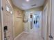 Welcoming foyer featuring coastal-themed decor, tiled flooring, and access to the kitchen and living areas at 122 Hartland Dr. # 11-D, Myrtle Beach, SC 29572