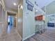 Inviting hallway featuring tiled flooring, leading to an open kitchen and dining area with barstool seating at 122 Hartland Dr. # 11-D, Myrtle Beach, SC 29572
