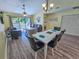 Bright living room with comfortable seating, leading to a balcony, and an adjacent dining area at 122 Hartland Dr. # 11-D, Myrtle Beach, SC 29572