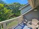 Scenic patio with comfortable chairs, offering an ideal space to unwind and appreciate the lush green surroundings at 122 Hartland Dr. # 11-D, Myrtle Beach, SC 29572