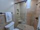 Bathroom with glass shower featuring tiled walls, a built-in seat, and ample shelving at 122 Hartland Dr. # 11-D, Myrtle Beach, SC 29572