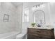 Bathroom with marble shower, vanity and arched mirror at 933 Bluffview Dr., Myrtle Beach, SC 29579