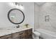 Bathroom with marble tile shower, bathtub, and modern vanity at 933 Bluffview Dr., Myrtle Beach, SC 29579