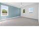 Charming bedroom with light blue accent wall and ceiling fan at 933 Bluffview Dr., Myrtle Beach, SC 29579