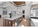 Gourmet kitchen boasts expansive island, stainless steel appliances, and white cabinetry at 933 Bluffview Dr., Myrtle Beach, SC 29579