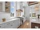 Modern kitchen features white cabinets, stainless steel appliances, and ample counter space at 933 Bluffview Dr., Myrtle Beach, SC 29579