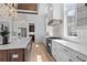 Modern kitchen with white cabinetry, quartz countertops and a gas range at 933 Bluffview Dr., Myrtle Beach, SC 29579