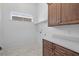 Laundry room with wood cabinets and white countertop at 933 Bluffview Dr., Myrtle Beach, SC 29579