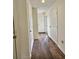 Interior hallway with wood floors and doors at 4214 Pinehurst Circle # G9, Little River, SC 29566