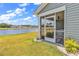 Screened porch overlooking a pond and green space at 528 Courtridge Loop, Conway, SC 29526