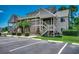 Inviting condominium with landscaped grounds, ample parking, and classic wood staircase at 1095 W Plantation Dr. W # 28D, Little River, SC 29566