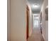 Hallway featuring carpet, neutral paint, and closet doors at 1095 W Plantation Dr. W # 28D, Little River, SC 29566