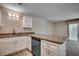 Kitchen with granite countertops, updated white cabinets, stainless faucet, and modern appliances at 1095 W Plantation Dr. W # 28D, Little River, SC 29566