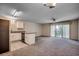Inviting living area with open kitchen, neutral carpeting and balcony access at 1095 W Plantation Dr. W # 28D, Little River, SC 29566